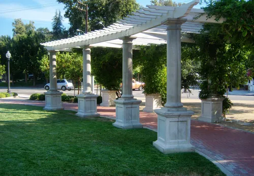 One of the plaza's Victorian pergolas offering shade along the brick walkway