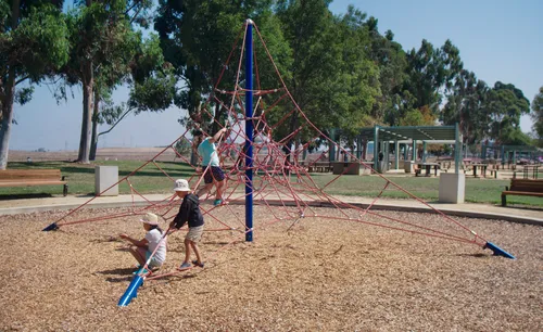 Children climb a rope structure in the south section of Baylands Park