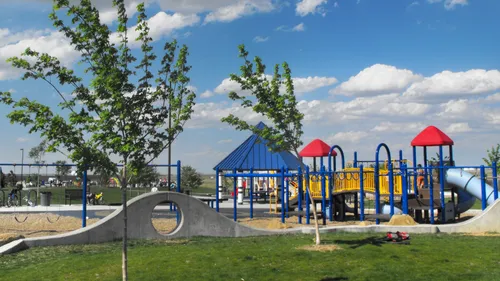 The park's playground area under blue skies