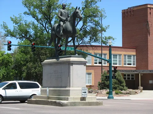 Statue of General William Jackson Palmer at the intersection adjacent to the park