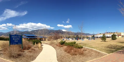 View of the park grounds with distant Colorado mountains