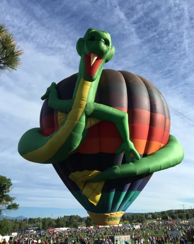 Whimsical snake-shaped balloon soars above the crowd