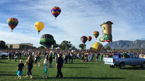 Hot air balloons of various colors ascending at the popular Colorado Springs Labor Day Lift Off