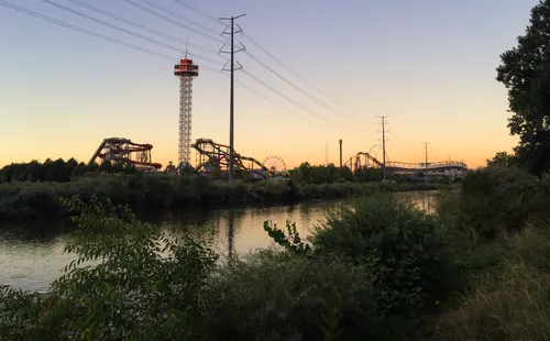 Island Kingdom Water Park visible across the river at dusk