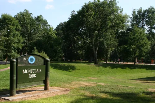 The entrance sign welcomes visitors to Montclair Park amid its lush lawns