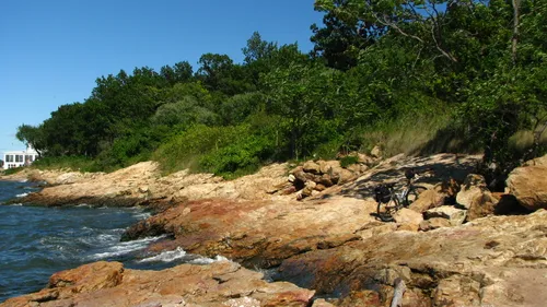 Rocky shoreline creates a natural boundary along the waterfront