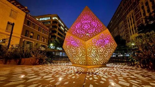 The artwork Golden Spike by HYBYCOZO is illuminated at the Connecticut Avenue Overlook