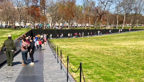 Visitors walk along the Vietnam Veterans Memorial's wall