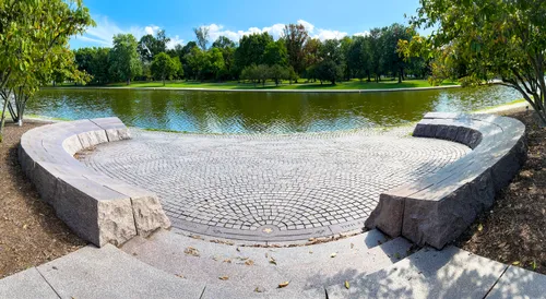 The arc-shaped Signers' Memorial with its carved stone elements