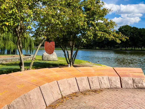 Signers' Memorial with red fingerprint sculpture The Soil You See in the background