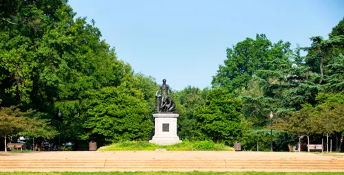 View of the park's lush greenery and its central memorial