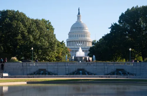 The U.S. Capitol building rises behind the Senate Fountain