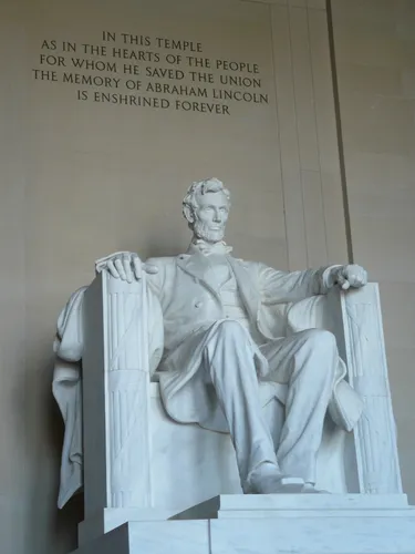 Lincoln seated in the grand interior chamber of his memorial