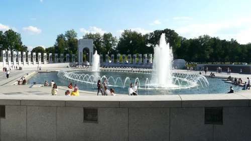 Visitors gather around the fountains of the World War II Memorial