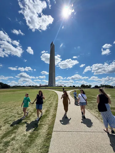 A sunny view toward the Washington Monument from the park's open grounds