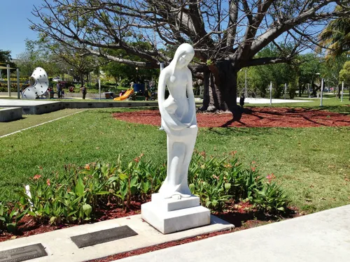 White statue stands elegantly among landscaped gardens in Young Circle