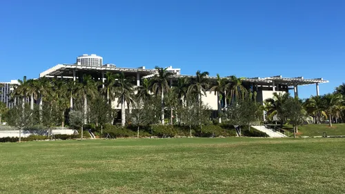 The museum hides behind rows of palm trees