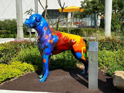 Vibrant blue and orange dog sculpture in the Sculpture Gardens