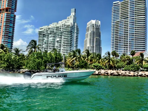 Police boat in front of the park's shoreline