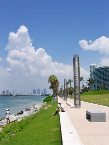 South Pointe Park Walk with grassy slopes and downtown Miami on the horizon