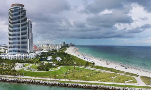 Aerial view of the park's green spaces meeting the Atlantic ocean