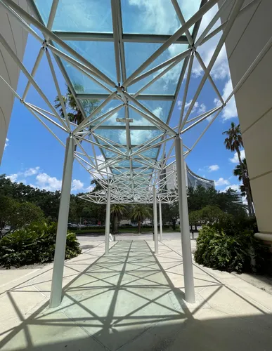 A geometric canopy leads toward the Orlando Science Center