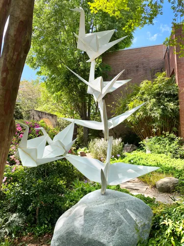 Sculptural origami provides artistic contrast to surrounding greenery