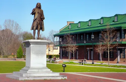 A statue of James Oglethorpe stands prominently in the center of the park