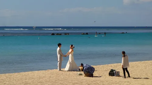 Couple holding hands by the ocean
