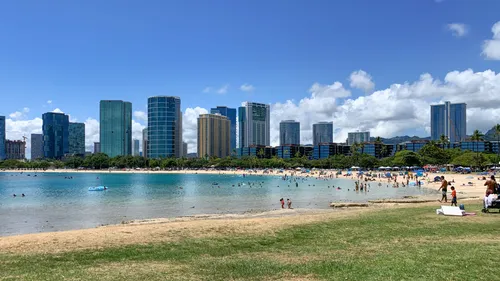 Expansive lawn and beach area with views of Honolulu