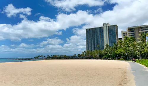 A walkway leads along the beach