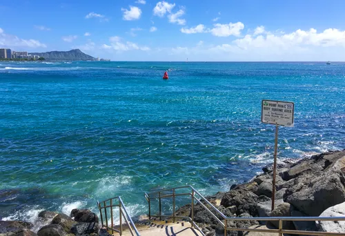 Turquoise waters and rocky shoreline at Point Panic