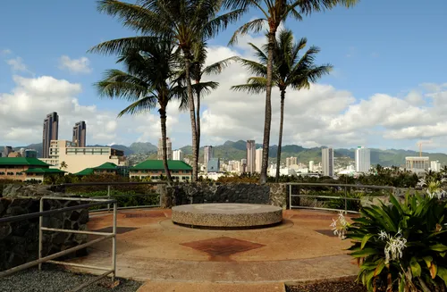 City buildings rise behind the hilltop plateau