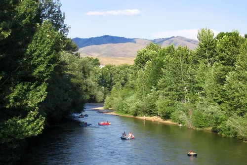 Boise River flows gently past forested shores