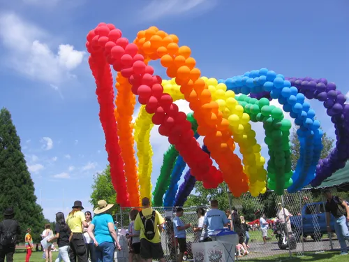 Vibrant rainbow balloon arch during the Spirit of Boise Balloon Classic