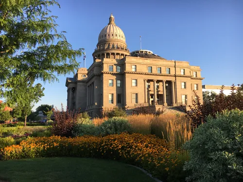 The gardens spread out before the east facade of the Idaho State Capitol building