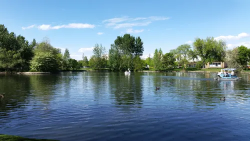 Visitors in paddle boats enjoying the lake