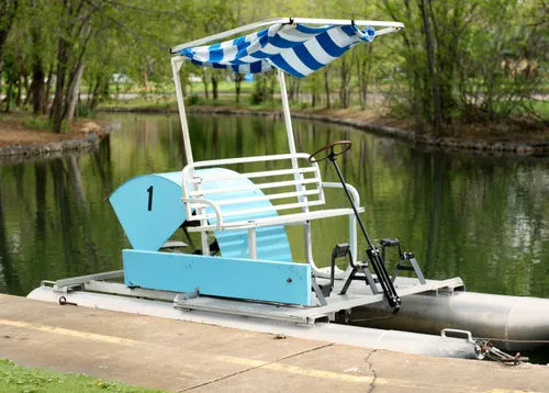 Paddle boat docked at the water's edge