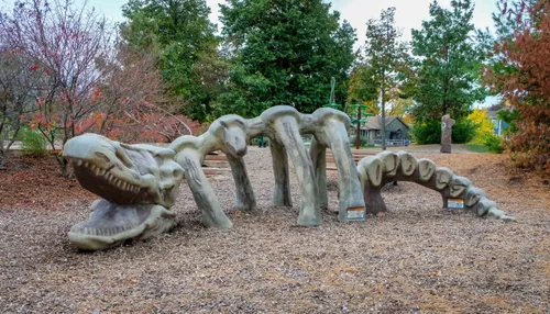 This dinosaur sculpture is part of the playground area