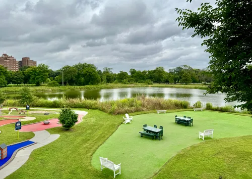 The miniature golf course and open lawn area next to the fieldhouse