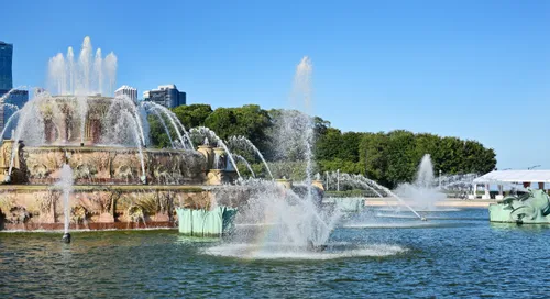 Buckingham Fountain's central water jets shooting skyward on a sunny day