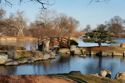 Serene bridge crosses water at the Garden of the Phoenix
