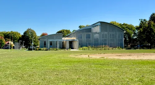 The Owens Park Fieldhouse sits along the park's large open lawn