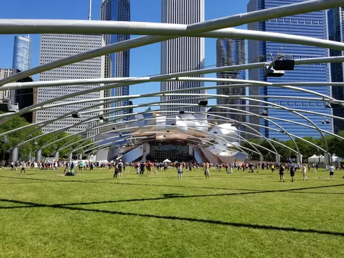 Jay Pritzker Pavilion's metal framework arches over the Great Lawn