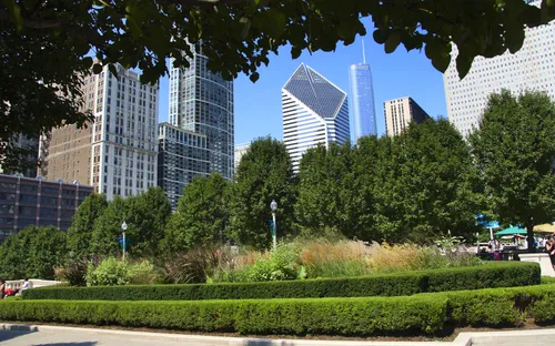 Lush gardens with Chicago's urban architecture visible beyond
