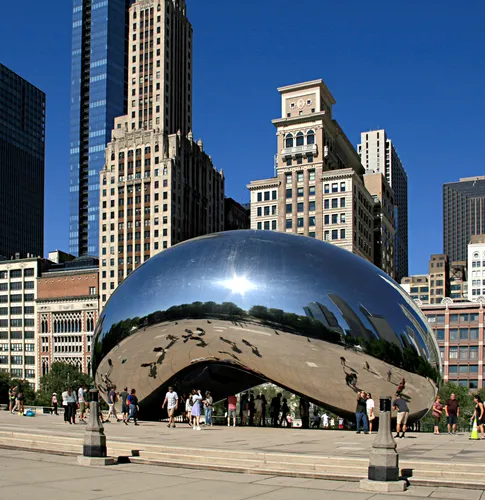 Cloud Gate reflects the surrounding cityscape in its polished surface