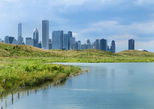 Chicago appears behind the calm waters of Northerly Island