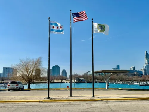 Flags fly in front of the Northerly Island Visitor Center