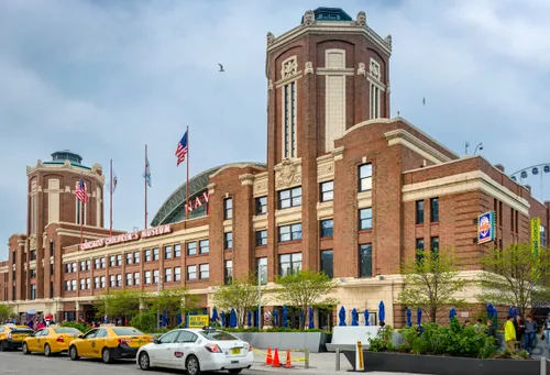 Navy Pier's grand brick entrance with taxis waiting outside