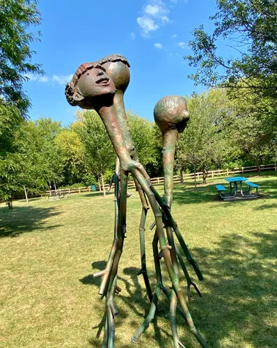 Shencheng Xu's sculpture Happy Family on a sunny day in the park
